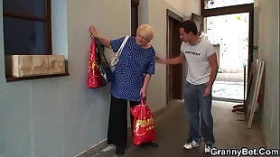 busty blonde granny pleases an young guy